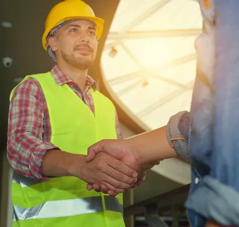 construction worker giving handshake